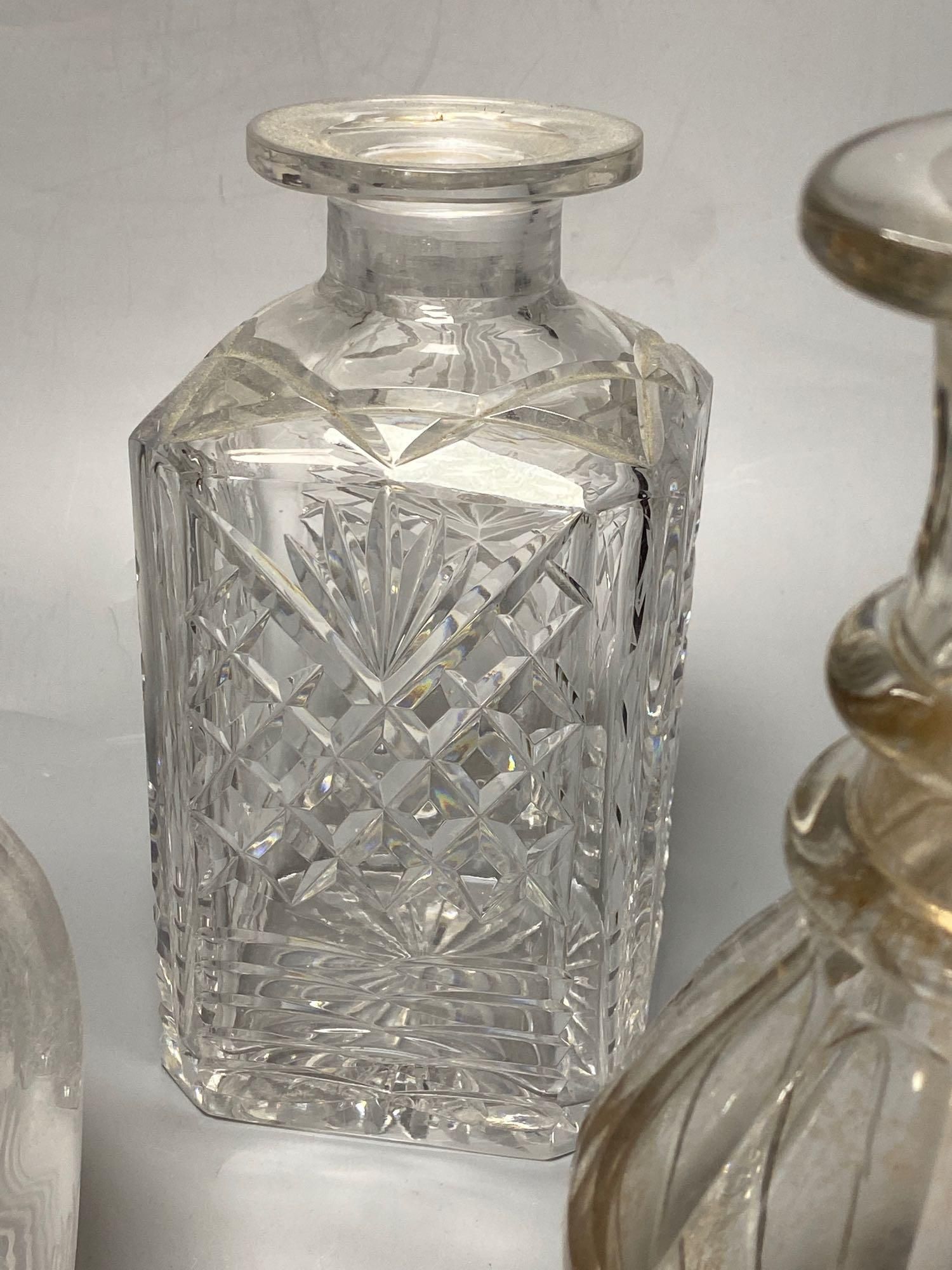 A pair of Regency glass mallet decanters with stoppers, 27cm and three other decanters (5)